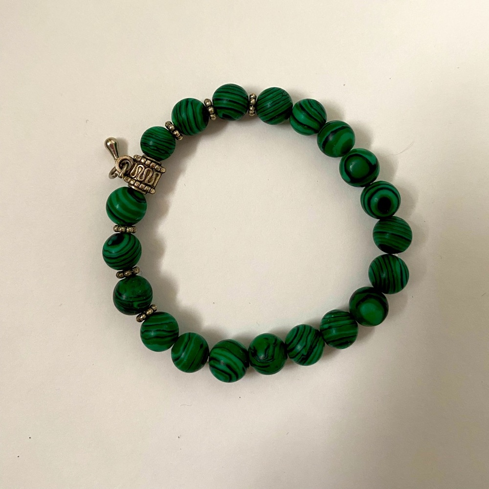 Cool bracelet with prayer wheels!